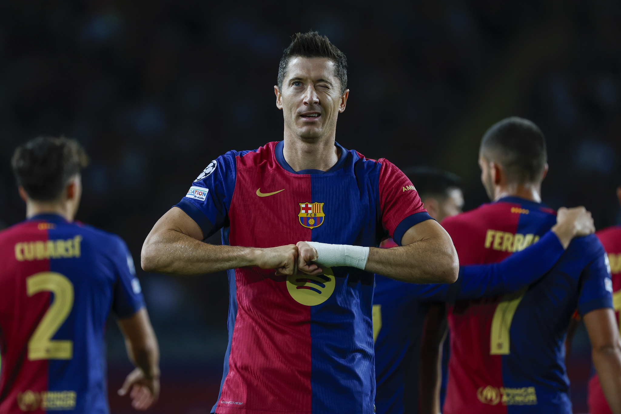 Robert Lewandowski celebrates after scoring his side's opening goal during the Champions League soccer match between  lt;HIT gt;Barcelona lt;/HIT gt; and Young Boys at the Lluis Companys Olympic Stadium in  lt;HIT gt;Barcelona lt;/HIT gt;, Spain, Tuesday, Oct. 1, 2024. (AP Photo/Joan Monfort)