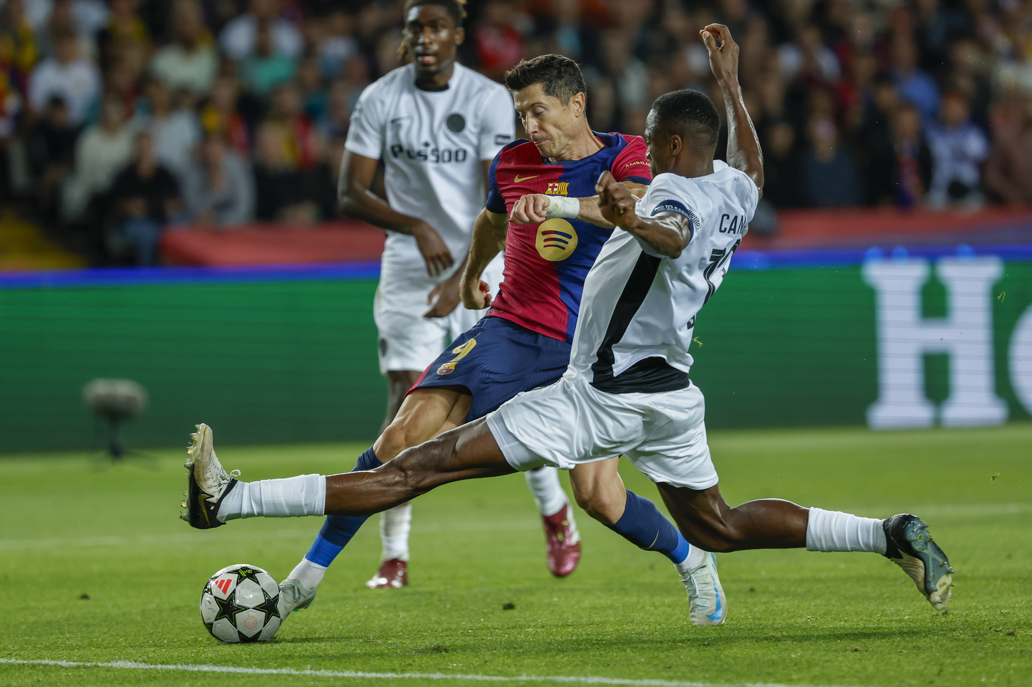 Robert Lewandowski is challenged by Young Boys' Mohamed Ali Camara