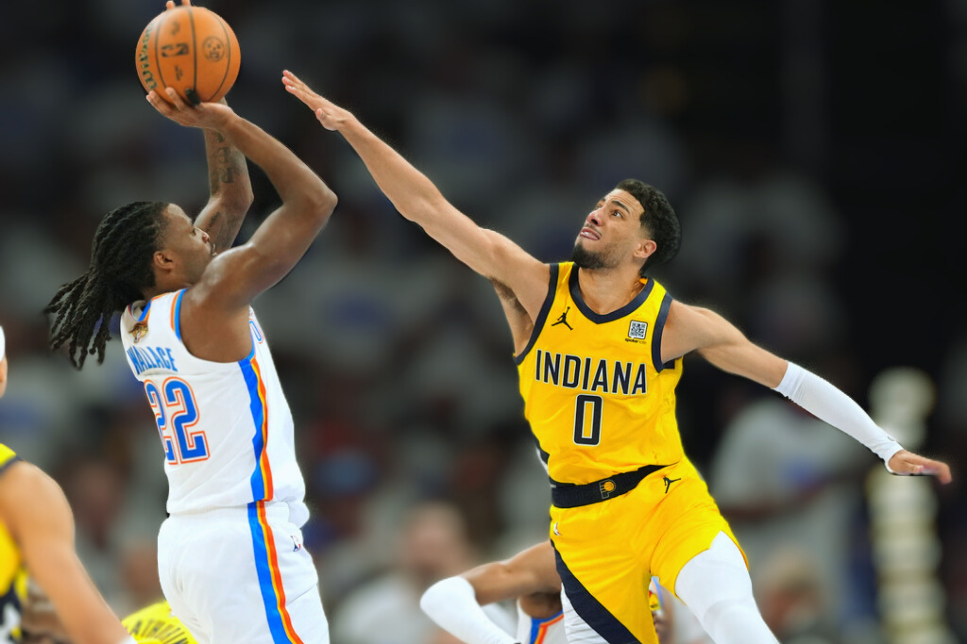 Oklahoma City Thunder guard Cason Wallace (22) shoots against Indiana Pacers guard Tyrese Haliburton (0) during the second half of Game 1 of the NBA Finals basketball.