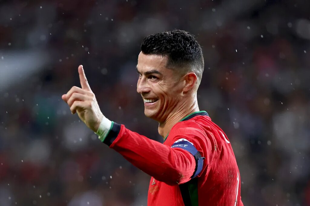 Cristiano Ronaldo’s mischievous peek through a door window sends a press room into frenzy