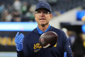 Jim Harbaugh defends Justin Herbert as turnovers mount before playoff push