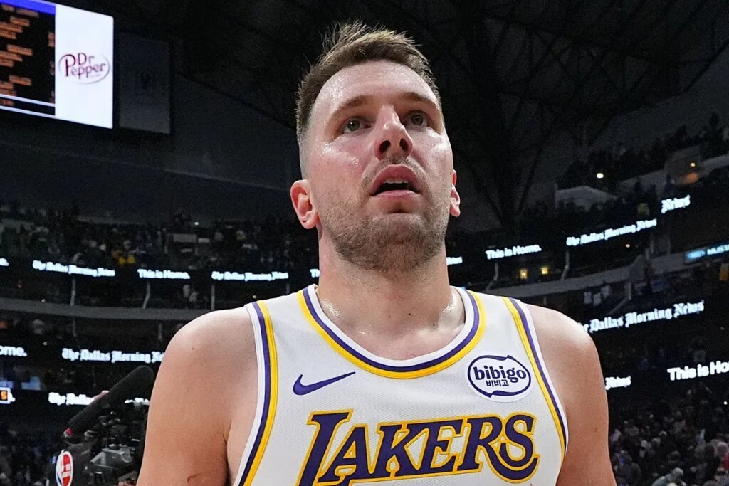 Luka Doncic blatantly turns his head as a dancer walks by at his birthday party