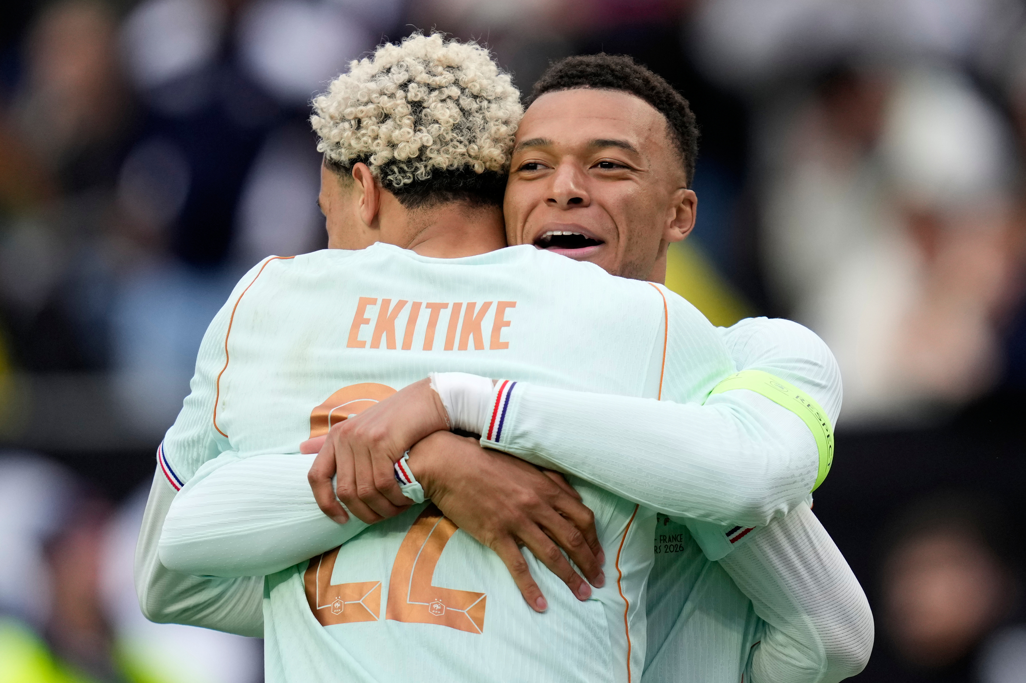 Hugo Ekitike of France embraces Kylian Mbappe after scoring his side's second goal past Brazilian goalkeeper Ederson during the international friendly soccer match between lt;HIT gt;Brazil lt;/HIT gt; and France in Foxborough, Mass, Thursday, March 26, 2026. (AP Photo/Charles Krupa)